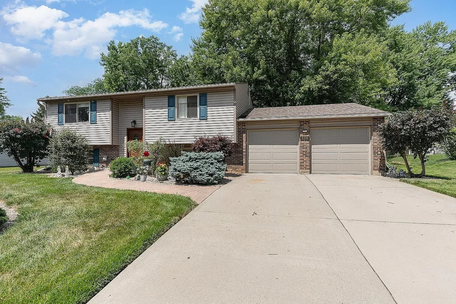 Front exterior of 809 Glendon Drive with driveway and two-car garage