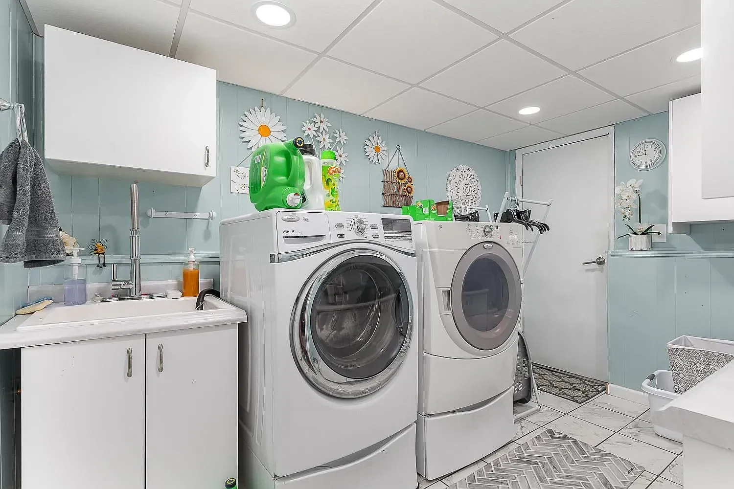 Laundry area with washer, dryer and utility sink